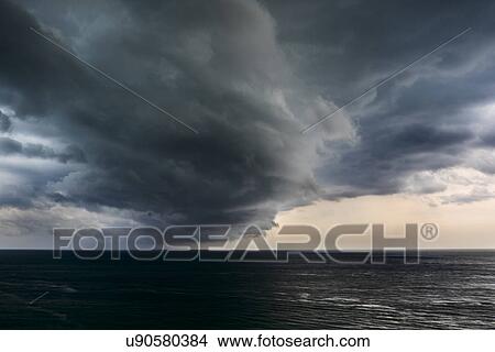 Picture - Cloud formations over sea. Fotosearch