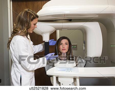 Dentist and patient in dentist's office View Large Photo Image Stock Photo - Dentist and patient in dentist's office. Fotosearch