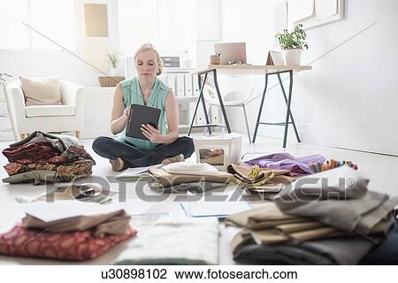 Design professional working in living room View Large Photo Image Stock Image - Design professional working in living room. Fotosearch