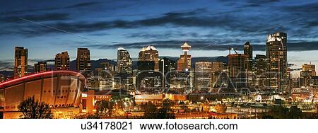 Stock Image - Downtown district at night . Fotosearch