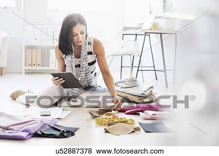 Stock Photo - Fashion designer in studio. Fotosearch