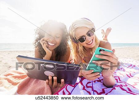 Female friends on beach View Large Photo Image Stock Image - Female friends on beach . Fotosearch