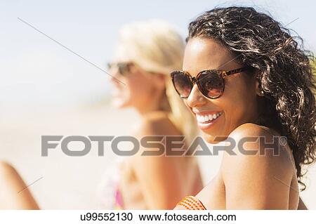 Female friends on beach View Large Photo Image Stock Image - Female friends on beach . Fotosearch