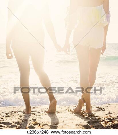 Stock Photo - Female friends on beach. Fotosearch