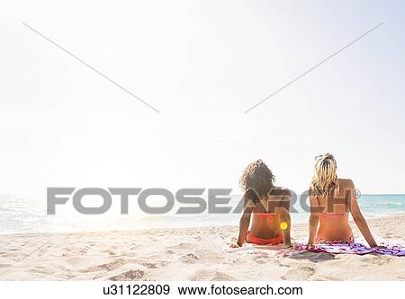 Female friends on beach View Large Photo Image Stock Photo - Female friends on beach . Fotosearch