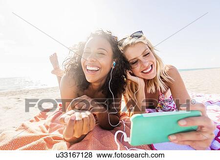 Female friends on beach View Large Photo Image Stock Photo - Female friends on beach . Fotosearch