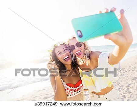 Female friends on beach View Large Photo Image Stock Photo - Female friends on beach. Fotosearch