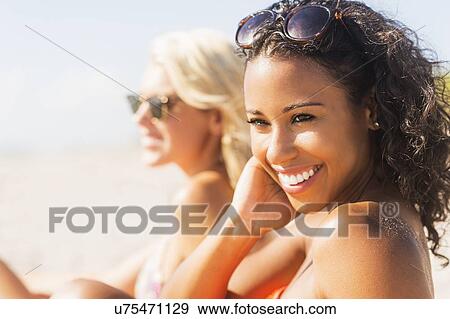 Female friends on beach View Large Photo Image Stock Photo - Female friends on beach . Fotosearch