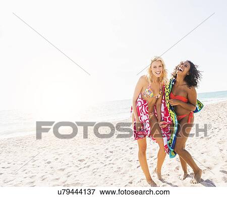 Female friends on beach View Large Photo Image Stock Photo - Female friends on beach . Fotosearch