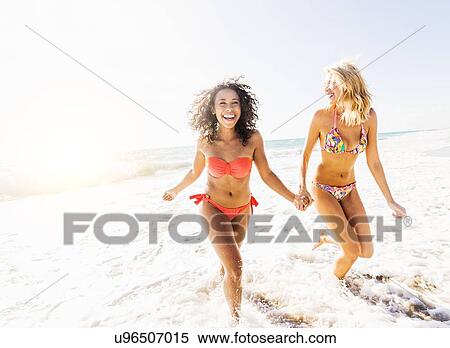 Female friends on beach View Large Photo Image Stock Photography - Female friends on beach . Fotosearch