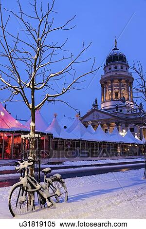 Stock Photography - Gendarmenmarkt, Snowy bicycle parked against bare tree. Fotosearch