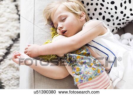 Girl (2-3) napping on sofa View Large Photo Image Stock Image - Girl (2-3) napping on sofa. Fotosearch