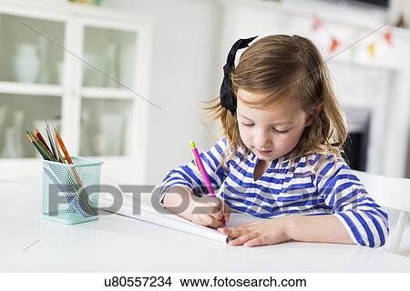 Girl (4-5) drawing in living room View Large Photo Image Picture - Girl (4-5) drawing in living room. Fotosearch