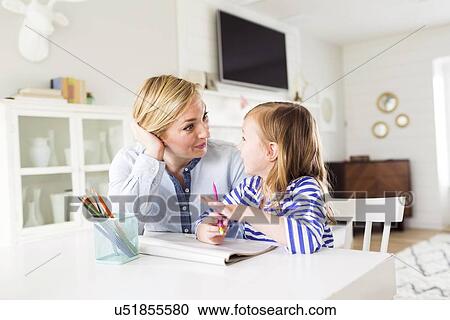 Girl (4-5) drawing with her mom View Large Photo Image Stock Image - Girl (4-5) drawing with her mom. Fotosearch