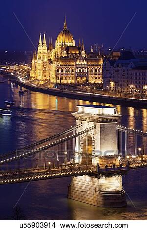 Illuminated Chain Bridge and Hungarian Parliament Building View Large Photo Image Picture - Illuminated Chain Bridge and Hungarian Parliament Building. Fotosearch