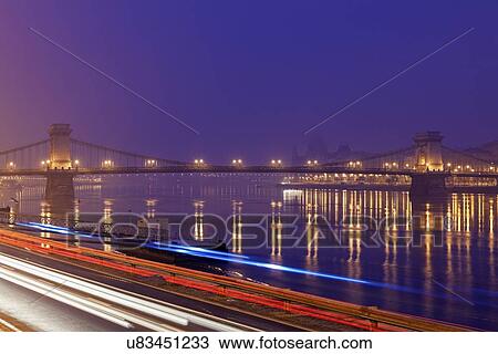 Illuminated Chain Bridge and light trails View Large Photo Image Stock Image - Illuminated Chain Bridge and light trails. Fotosearch