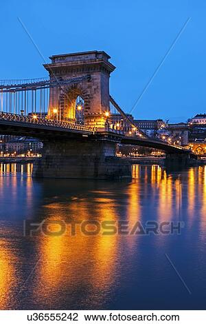 Illuminated Chain Bridge and reflections on water View Large Photo Image Stock Image - Illuminated Chain Bridge and reflections on water. Fotosearch