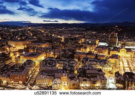 Illuminated cityscape at dusk View Large Photo Image Stock Photography - Illuminated cityscape at dusk. Fotosearch
