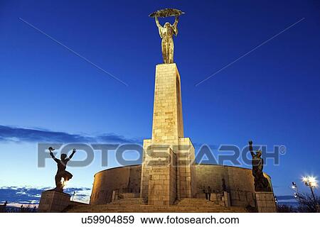 Illuminated Liberty Statue against sky View Large Photo Image Stock Photo - Illuminated Liberty Statue against sky. Fotosearch