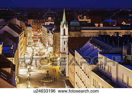 Illuminated old town street with tower of Schlosskirche View Large Photo Image Stock Photograph - Illuminated old town street with tower of Schlosskirche. Fotosearch