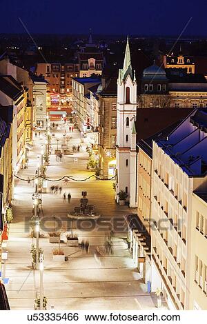 Illuminated old town street with tower of Schlosskirche View Large Photo Image Stock Photograph - Illuminated old town street with tower of Schlosskirche. Fotosearch
