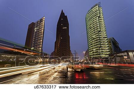 Illuminated skyscrapers and street traffic View Large Photo Image Stock Photo - Illuminated skyscrapers and street traffic. Fotosearch