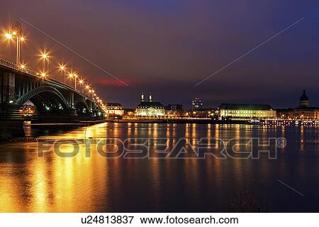 Stock Photo - Illuminated Theodor Heuss Bridge and waterfront skyline. Fotosearch