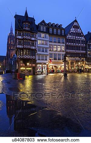 Illuminated townhouses and square View Large Photo Image Stock Image - Illuminated townhouses and square. Fotosearch