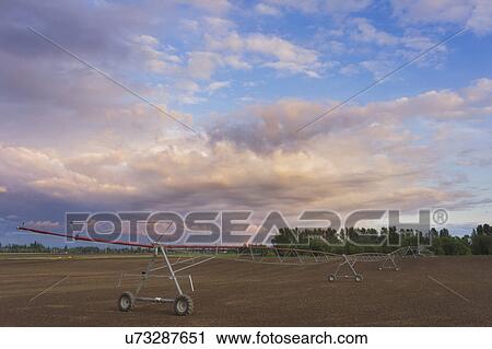 Irrigation equipment in field View Large Photo Image Stock Image - Irrigation equipment in field. Fotosearch