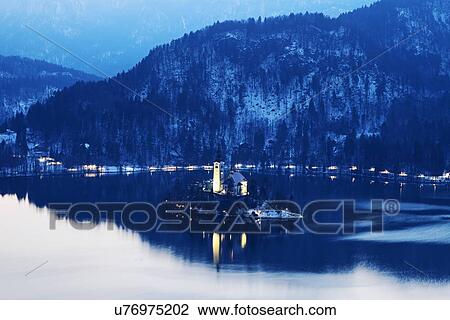 Lake Bled and illuminated Church of the Assumption on island View Large Photo Image Stock Image - Lake Bled and illuminated Church of the Assumption on island. Fotosearch