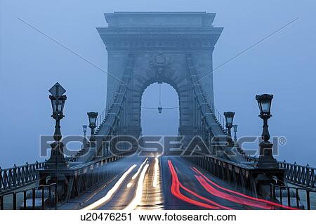 Stock Image - Light trails on Chain Bridge. Fotosearch