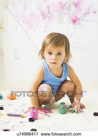 Little girl (2-3) painting on carpet View Large Photo Image Stock Image - Little girl (2-3) painting on carpet. Fotosearch