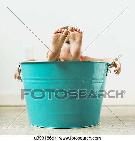 Little girl (2-3) sitting in turquoise bucket View Large Photo Image Stock Photo - Little girl (2-3) sitting in turquoise bucket. Fotosearch