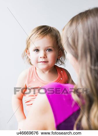 Little girl (2-3) with mother View Large Photo Image Stock Photograph - Little girl (2-3) with mother. Fotosearch