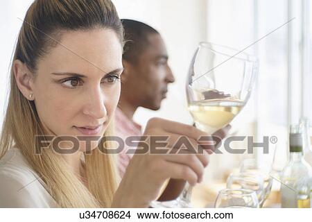 Man and woman tasting white wine View Large Photo Image Picture - Man and woman tasting white wine. Fotosearch