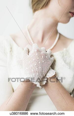 Mid section of bride wearing formal glove View Large Photo Image Stock Photograph - Mid section of bride wearing formal glove. Fotosearch