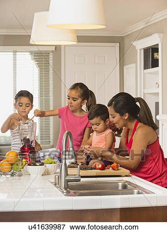Mother and children (2-3, 6-7, 8-9) preparing fruit cocktails View Large Photo Image Stock Photo - Mother and children (2-3, 6-7, 8-9) preparing fruit cocktails. Fotosearch