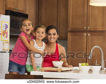 Mother and children (6-7, 8-9) preparing food in kitchen View Large Photo Image Stock Image - Mother and children (6-7, 8-9) preparing food in kitchen. Fotosearch