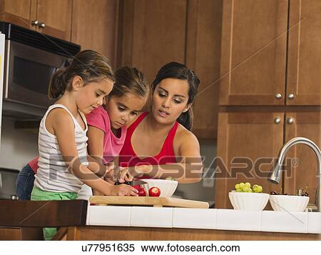 Mother and children (6-7, 8-9) preparing food in kitchen View Large Photo Image Stock Photography - Mother and children (6-7, 8-9) preparing food in kitchen. Fotosearch