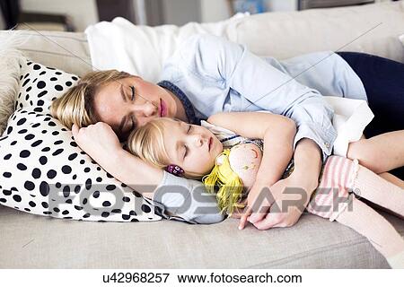 Mother and daughter (2-3) sleeping on sofa View Large Photo Image Stock Photo - Mother and daughter (2-3) sleeping on sofa. Fotosearch