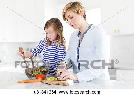 Picture - Mother and daughter (4-5) preparing salad. Fotosearch