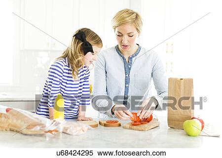 Mother making sandwiches for her daughter (4-5) View Large Photo Image Stock Photography - Mother making sandwiches for her daughter (4-5). Fotosearch