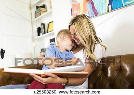 Mother reading book to son (4-5) View Large Photo Image Stock Image - Mother reading book to son (4-5) . Fotosearch