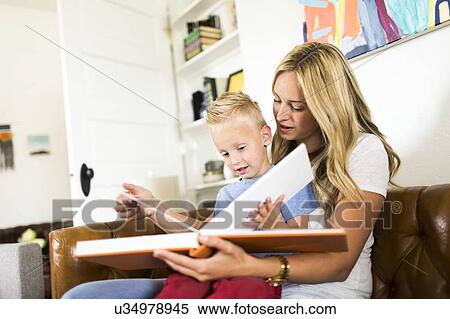 Mother reading book to son (4-5) View Large Photo Image Stock Photography - Mother reading book to son (4-5) . Fotosearch