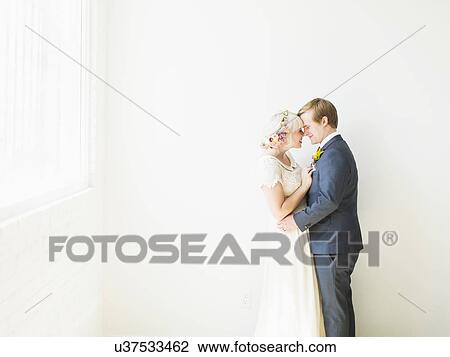 Newlywed couple embracing View Large Photo Image Stock Image - Newlywed couple embracing. Fotosearch