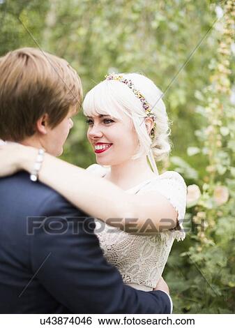 Newlywed couple embracing View Large Photo Image Stock Photograph - Newlywed couple embracing. Fotosearch