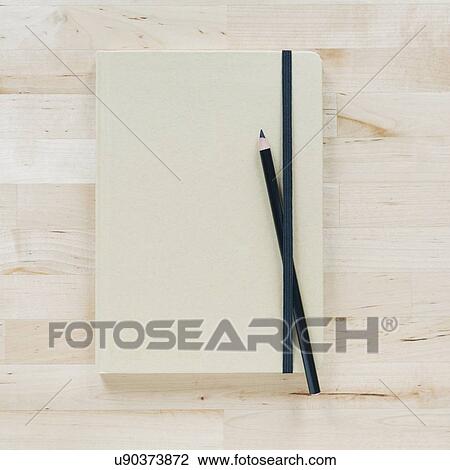 Stock Image - Overhead view of notebooks. Fotosearch