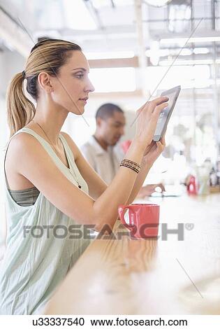 Stock Image - People in coffee shop. Fotosearch