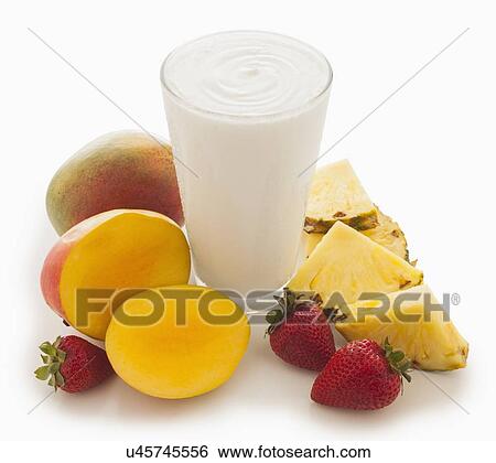 Stock Photograph - Pineapple, mango and strawberry smoothie. Fotosearch