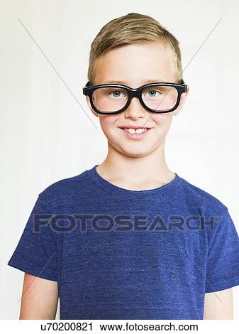 Portrait of boy (6-7) wearing eyeglasses View Large Photo Image Stock Image - Portrait of boy (6-7) wearing eyeglasses. Fotosearch